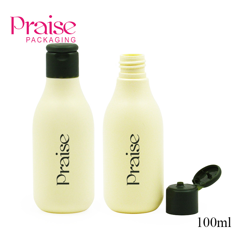 Custom empty cosmetic travel container with flip lid, reusable 100ml round PE plastic lotion/shampoo bottle